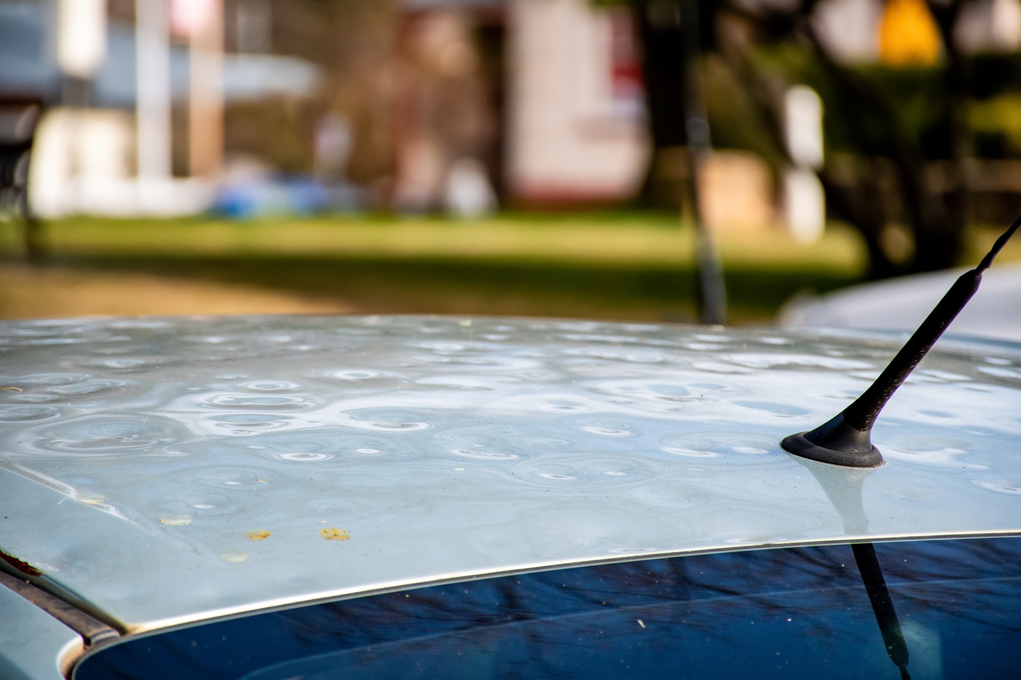 Car roof damaged by major hailstorm hailstones. Car insurance repair dents.